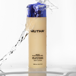 bottle of shower gel enveloped by splash of water