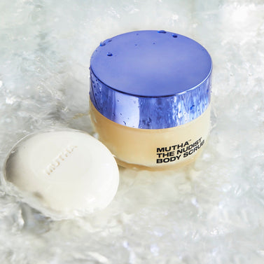 Stylish image of the Nudist Body Bar and Body Scrub standing in water