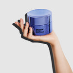 Image of a hand holding the Body Butter