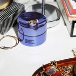 Image of the Body Butter on a filled countertop with a ring on top