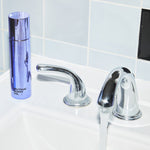 Stylish image of the Body Oil on a sink counter with water running from the faucet