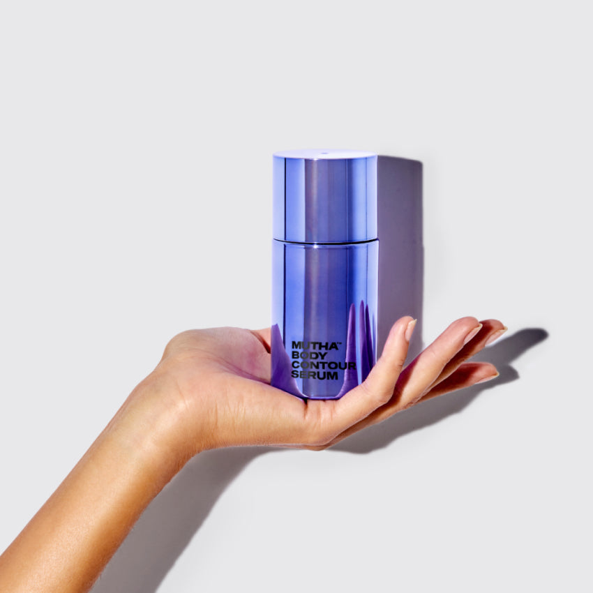 Image of a hand holding the Body Contour Serum