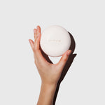 Image of a hand holding the Nudist Exfoliating Body Bar